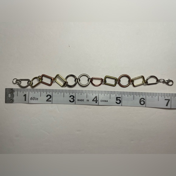 Tri-tone Geometric Bracelet in gold, silver, and copper tones. - Picture 4 of 4